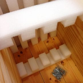 A wooden case with foam lining for protection