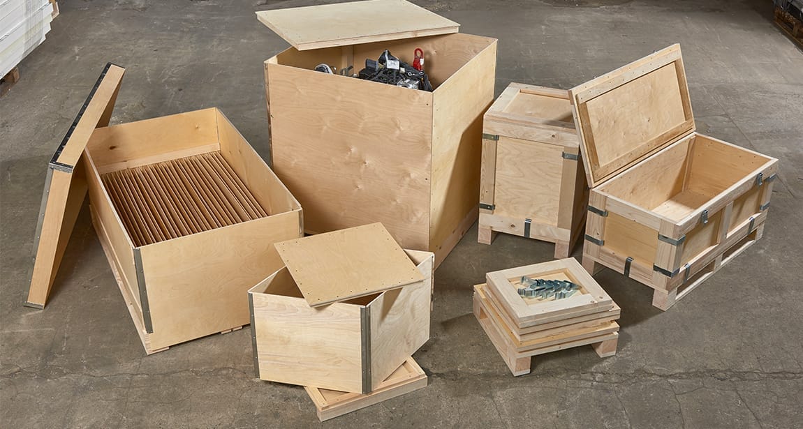 Wooden crates designed by Trafalgar Cases, showcasing a secure, tailored fit for delicate instruments, surrounded by tools and materials, emphasizing custom packaging solutions.