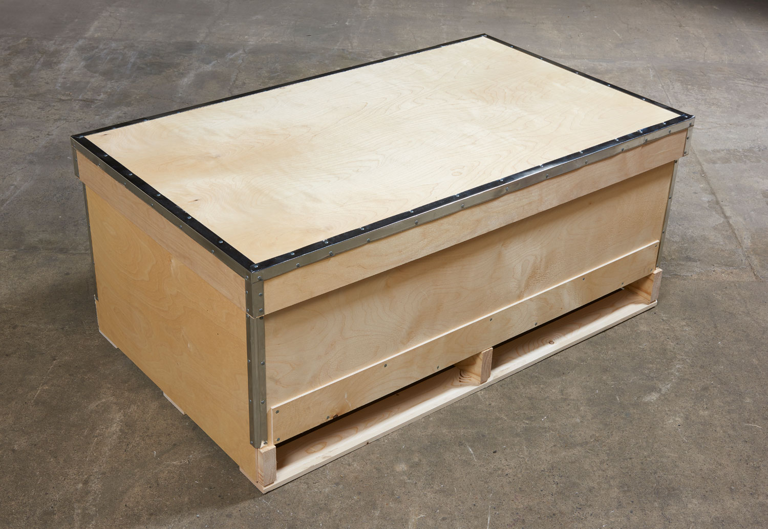 Wooden case reinforced with metal edges