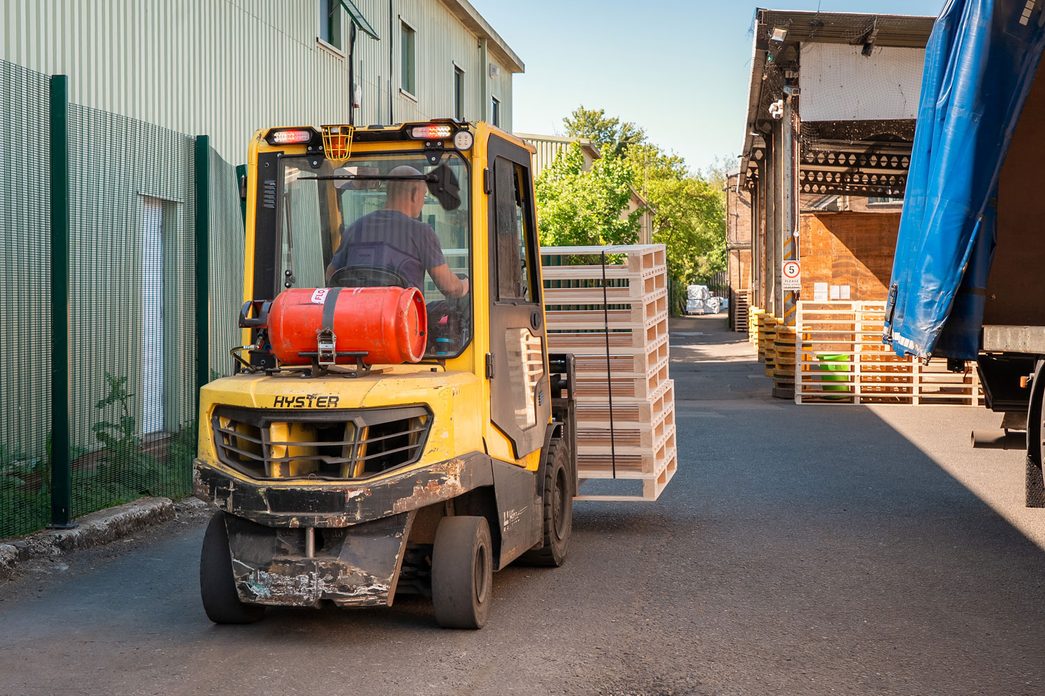 Forklift truck loading pallets