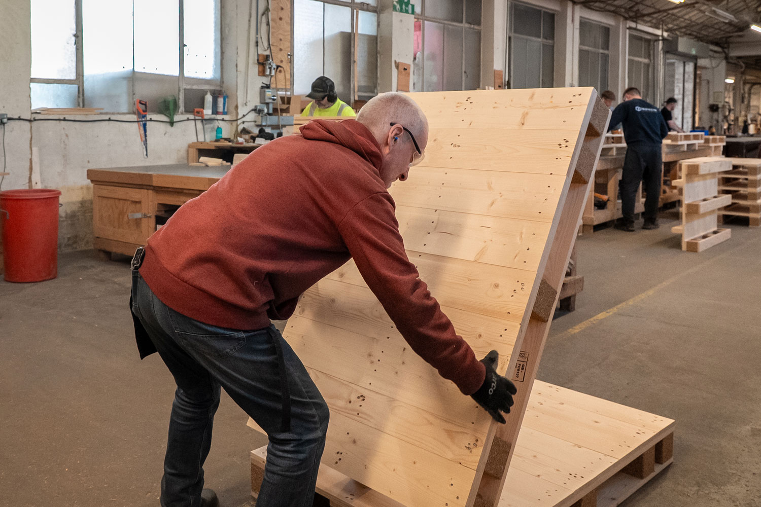 Staff building custom wooden pallets